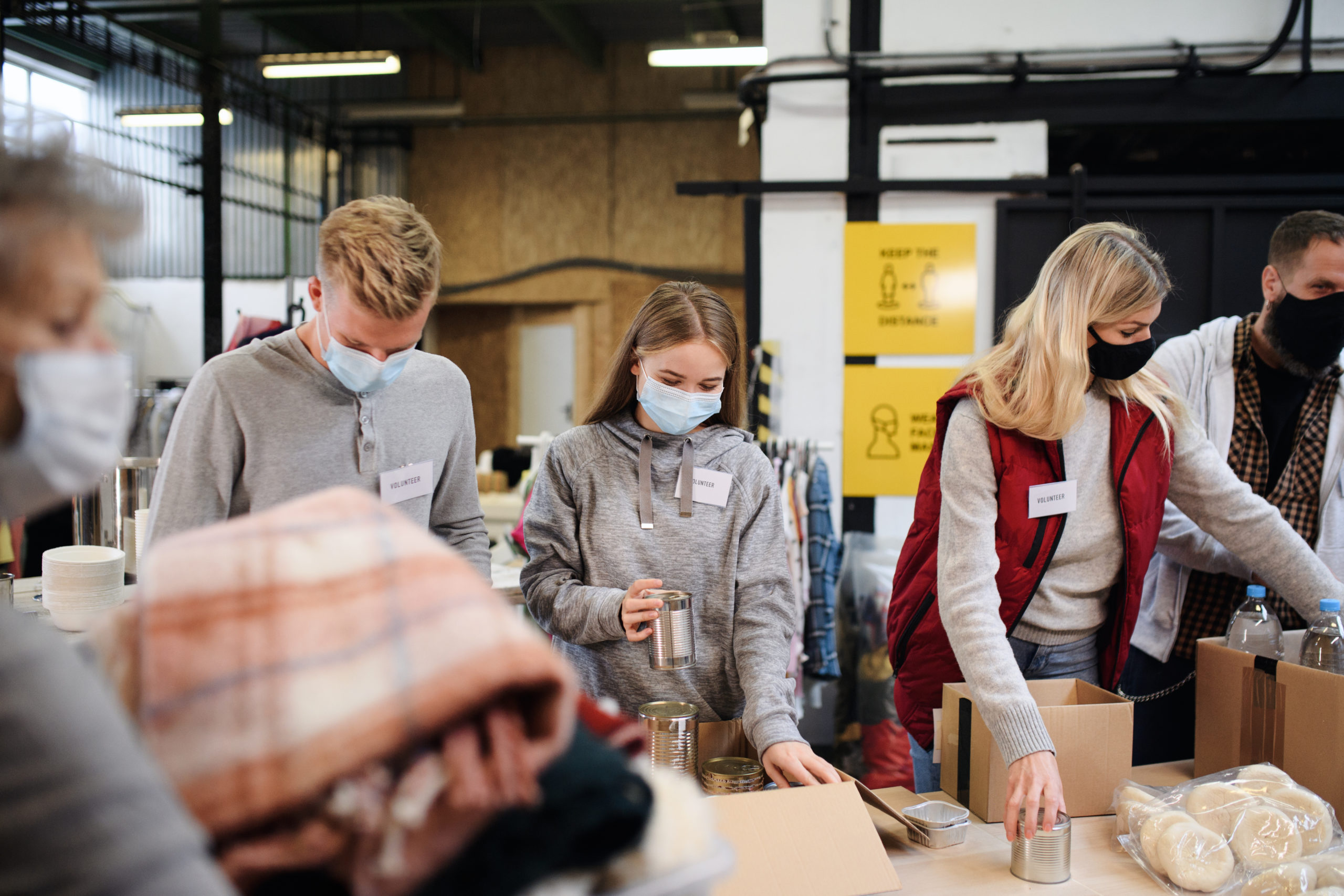 group of volunteers helping and performing service and charity